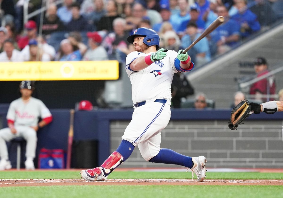 Sep 3, 2024; Toronto, Ontario, CAN; Toronto Blue Jays catcher Alejandro Kirk (30) hits an RBI single against the Philadelphia Phillies during the first inning at Rogers Centre. Mandatory Credit: Nick Turchiaro-Imagn Images