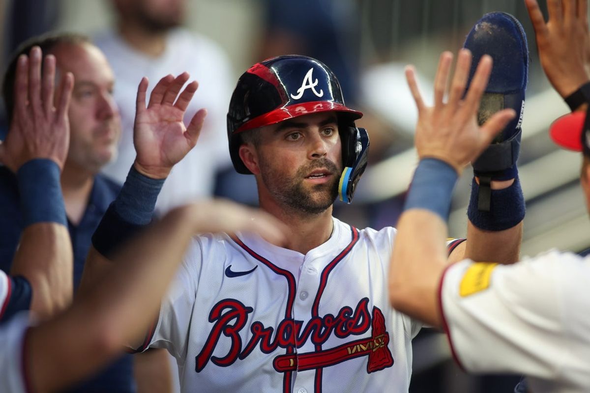 Sep 3, 2024; Atlanta, Georgia, USA; Atlanta Braves second baseman Whit Merrifield (15) celebrates with teammates after scoring a run against the Colorado Rockies in the third inning at Truist Park. Mandatory Credit: Brett Davis-Imagn Images