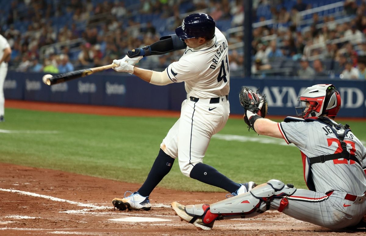Sep 3, 2024; St. Petersburg, Florida, USA; Tampa Bay Rays catcher Logan Driscoll (41) hits an RBI single for his first career MLB hit during the third inning against the Minnesota Twins at Tropicana Field. Mandatory Credit: Kim Klement Neitzel-Imagn Images