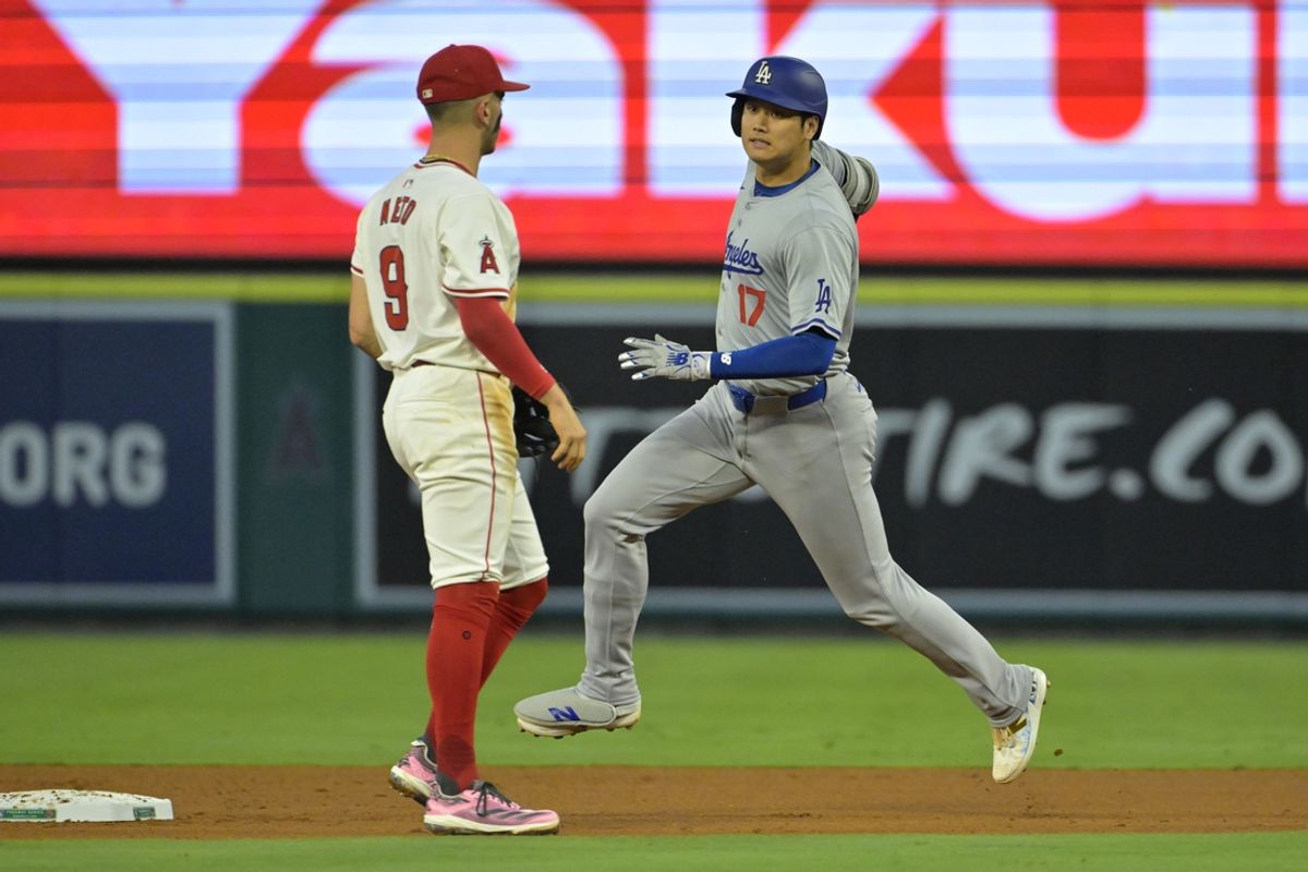 Sep 3, 2024; Anaheim, California, USA;  Los Angeles Dodgers designated hitter Shohei Ohtani (17) rounds the bases on a triple in the third inning against the Los Angeles Angels at Angel Stadium. Mandatory Credit: Jayne Kamin-Oncea-Imagn Images