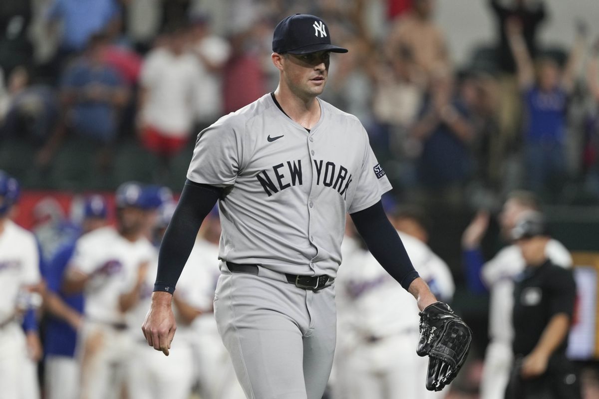 Sep 3, 2024; Arlington, Texas, USA; New York Yankees relief pitcher Clay Holmes (35) walks from the field after giving up a grand slam walk-off to Texas Rangers center fielder Wyatt Langford (not shown) during the ninth inning at Globe Life Field. Mandatory Credit: Jim Cowsert-Imagn Images