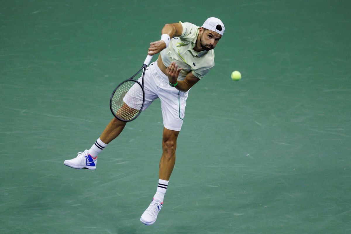 Sep 3, 2024; Flushing, NY, USA;  Grigor Dimitrov of Bulgaria in action against Frances Tiafoe of the United States on day nine of the U.S. Open tennis tournament at the USTA Billie Jean King National Tennis Center. Mandatory Credit: Mike Frey-Imagn Images