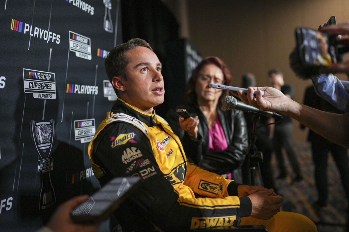 Sep 4, 2024; Charlotte, North Carolina, USA;  Christopher Bell speaks to media members during the NASCAR Playoffs Media Day at the Charlotte Convention Center. Mandatory Credit: Jim Dedmon-Imagn Images