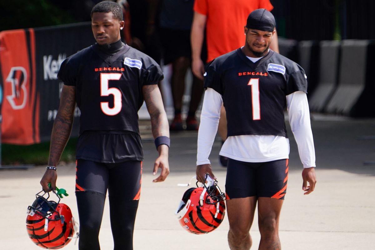 Cincinnati Bengals wide receiver Tee Higgins (5) and Cincinnati Bengals wide receiver Ja'Marr Chase (1) walk to the practice field, Wednesday, Sept. 4, 2024, in Cincinnati.