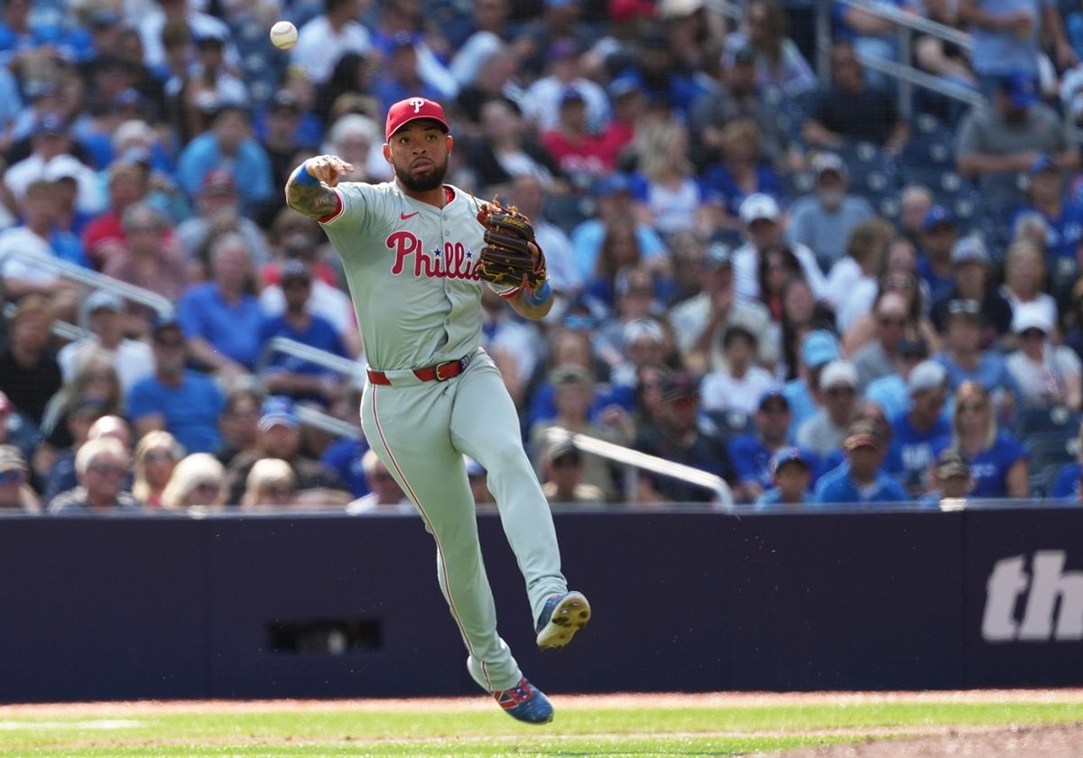 Sep 4, 2024; Toronto, Ontario, CAN; Philadelphia Phillies third baseman Edmundo Sosa (33) throws a ball to first for the out against the Toronto Blue Jays during the fourth inning at Rogers Centre. Mandatory Credit: Nick Turchiaro-Imagn Images