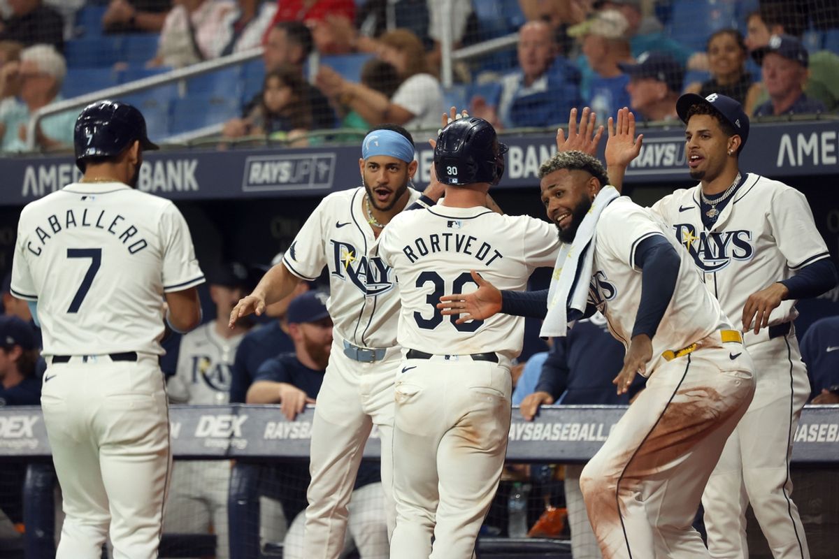 Sep 4, 2024; St. Petersburg, Florida, USA;  Tampa Bay Rays catcher Ben Rortvedt (30) and shortstop Jose Caballero (7) are congratulated by infielder Junior Caminero (13), outfielder Jose Siri (22) and infielder Christopher Morel (24) during the fourth inning against the Minnesota Twins at Tropicana Field. Mandatory Credit: Kim Klement Neitzel-Imagn Images