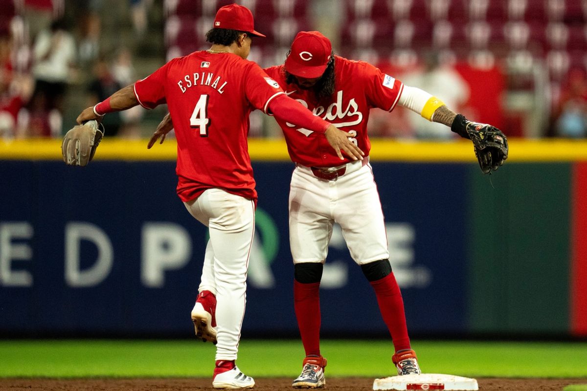 Cincinnati Reds second baseman Jonathan India (6) and Cincinnati Reds third baseman Santiago Espinal (4) react after the Cincinnati Reds defeated Houston Astros 12-5 at Great American Ball Park in Cincinnati on Wednesday, Sept. 4, 2024.