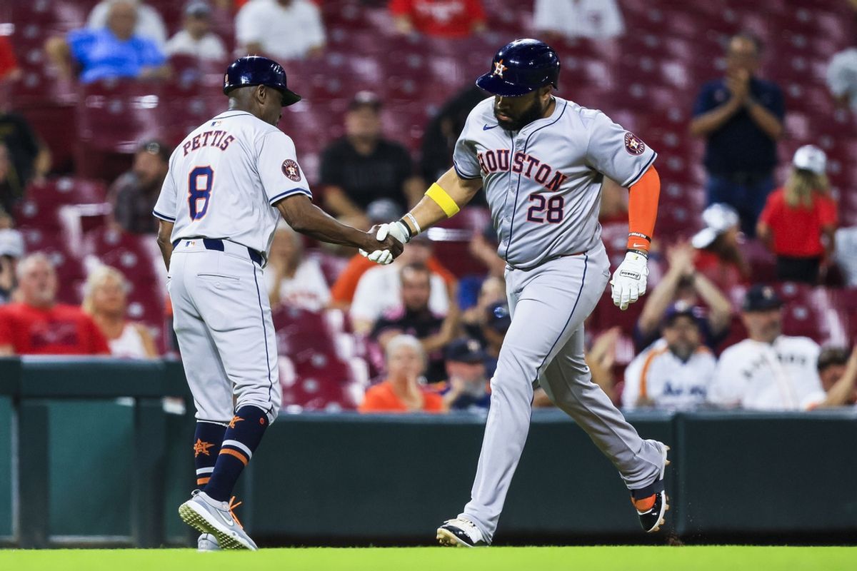 Sep 4, 2024; Cincinnati, Ohio, USA; Houston Astros first baseman Jon Singleton (28) shakes hands with third base coach Gary Pettis (8) after hitting a solo home run in the seventh inning against the Cincinnati Reds at Great American Ball Park. Mandatory Credit: Katie Stratman-Imagn Images
