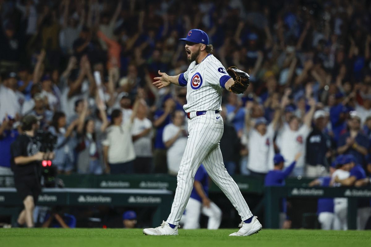 Sep 4, 2024; Chicago, Illinois, USA; Chicago Cubs relief pitcher Porter Hodge (37) celebrates teams win against the Pittsburgh Pirates in a baseball game at Wrigley Field. Mandatory Credit: Kamil Krzaczynski-Imagn Images