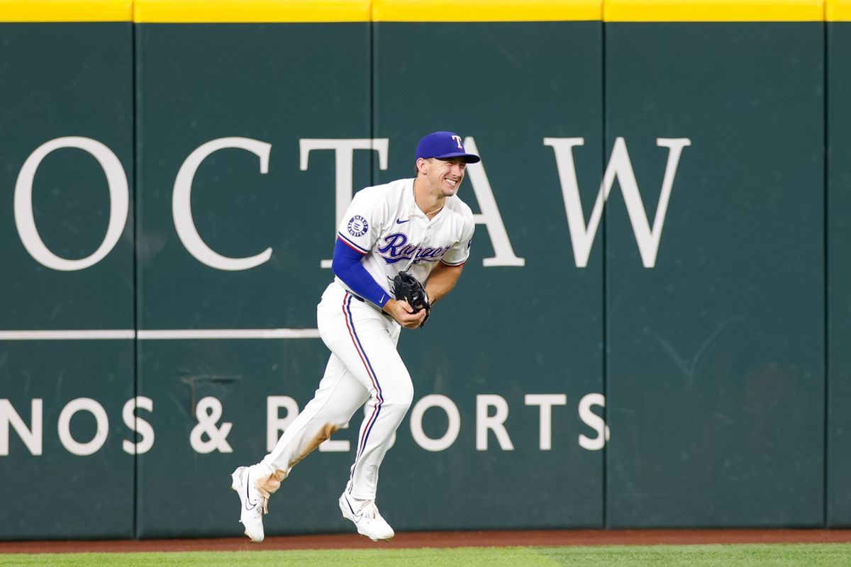 Sep 4, 2024; Arlington, Texas, USA; Texas Rangers outfielder Wyatt Langford (36) makes a catch at the wall to end the game between the Texas Rangers and New York Yankees at Globe Life Field. Mandatory Credit: Andrew Dieb-Imagn Images