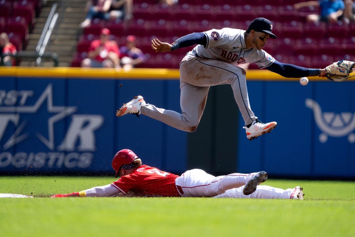 Cincinnati Reds right fielder Jake Fraley (27) steels second as Houston Astros shortstop Jeremy Pena (3) makes an attempt on the throw from home in the second inning of the MLB game at Great American Ball Park in Cincinnati on Wednesday, Sept. 4, 2024.