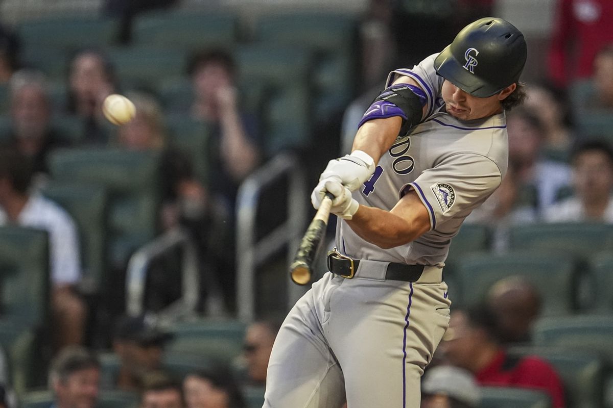 Sep 5, 2024; Cumberland, Georgia, USA; Colorado Rockies center fielder Brenton Doyle (9) hits a home run against the Atlanta Braves during the second inning at Truist Park. Mandatory Credit: Dale Zanine-Imagn Images