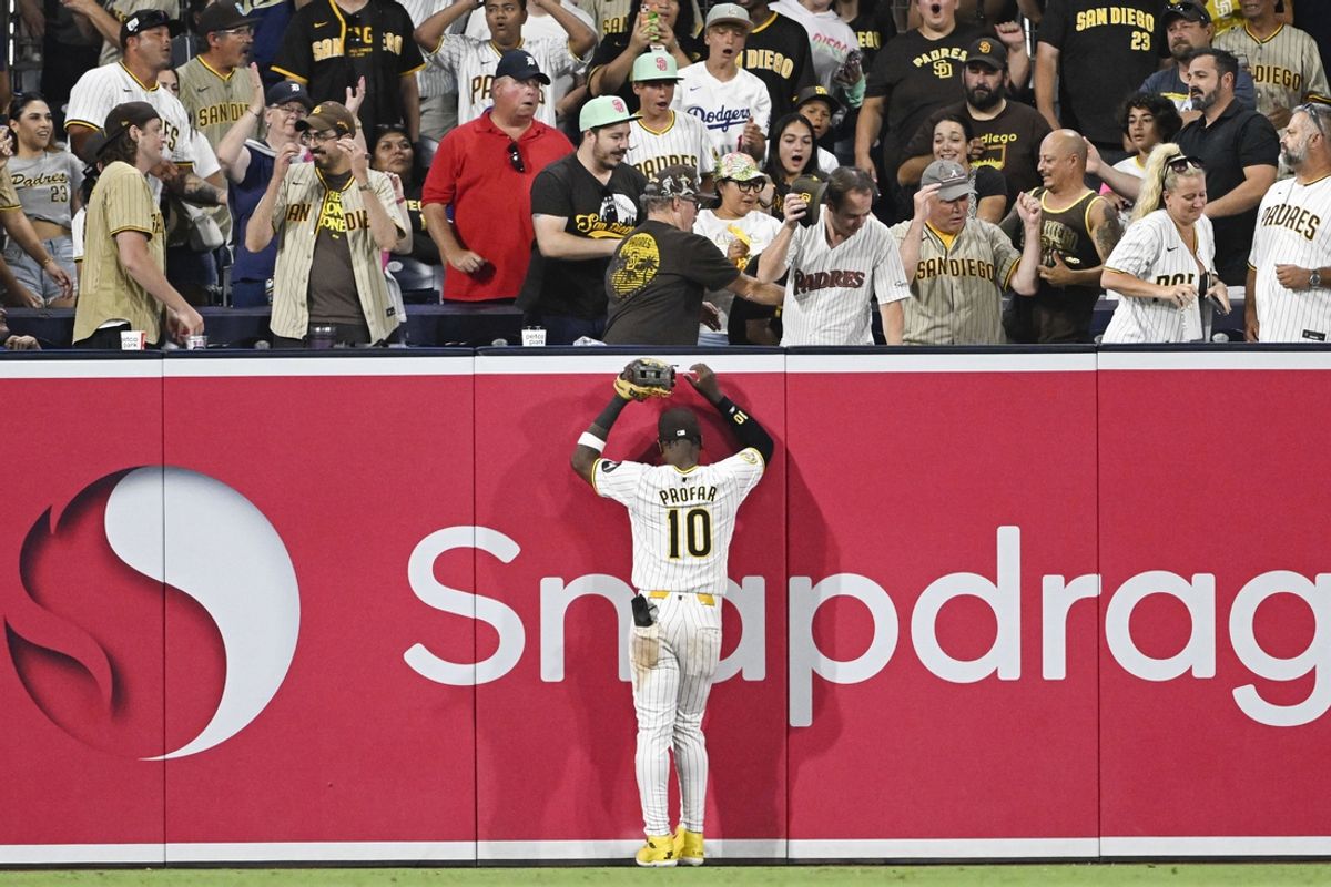 Sep 5, 2024; San Diego, California, USA; San Diego Padres left fielder Jurickson Profar (10) watches a grand slam hit by Detroit Tigers center fielder Parker Meadows (not pictured) go over the wall during the ninth inning at Petco Park. Mandatory Credit: Denis Poroy-Imagn Images
