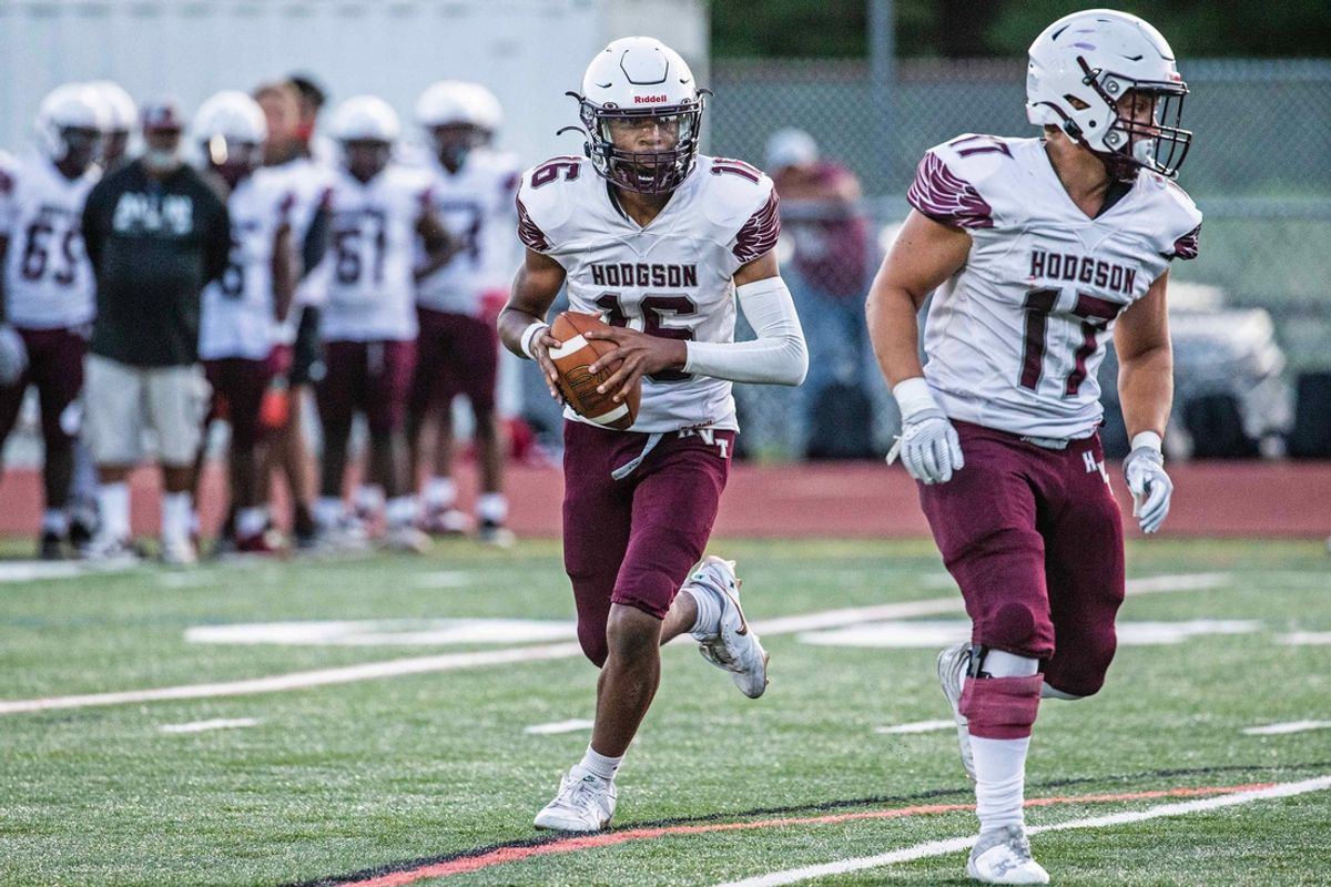 Hodgson senior Xavier Brown (16) looks for an open receiver with senior Jace Hawkins (17) covering against Caravel during the football game at Caravel's Bob Peoples Stadium in Bear, Thursday, Sept. 5, 2024. Caravel won 31-6.