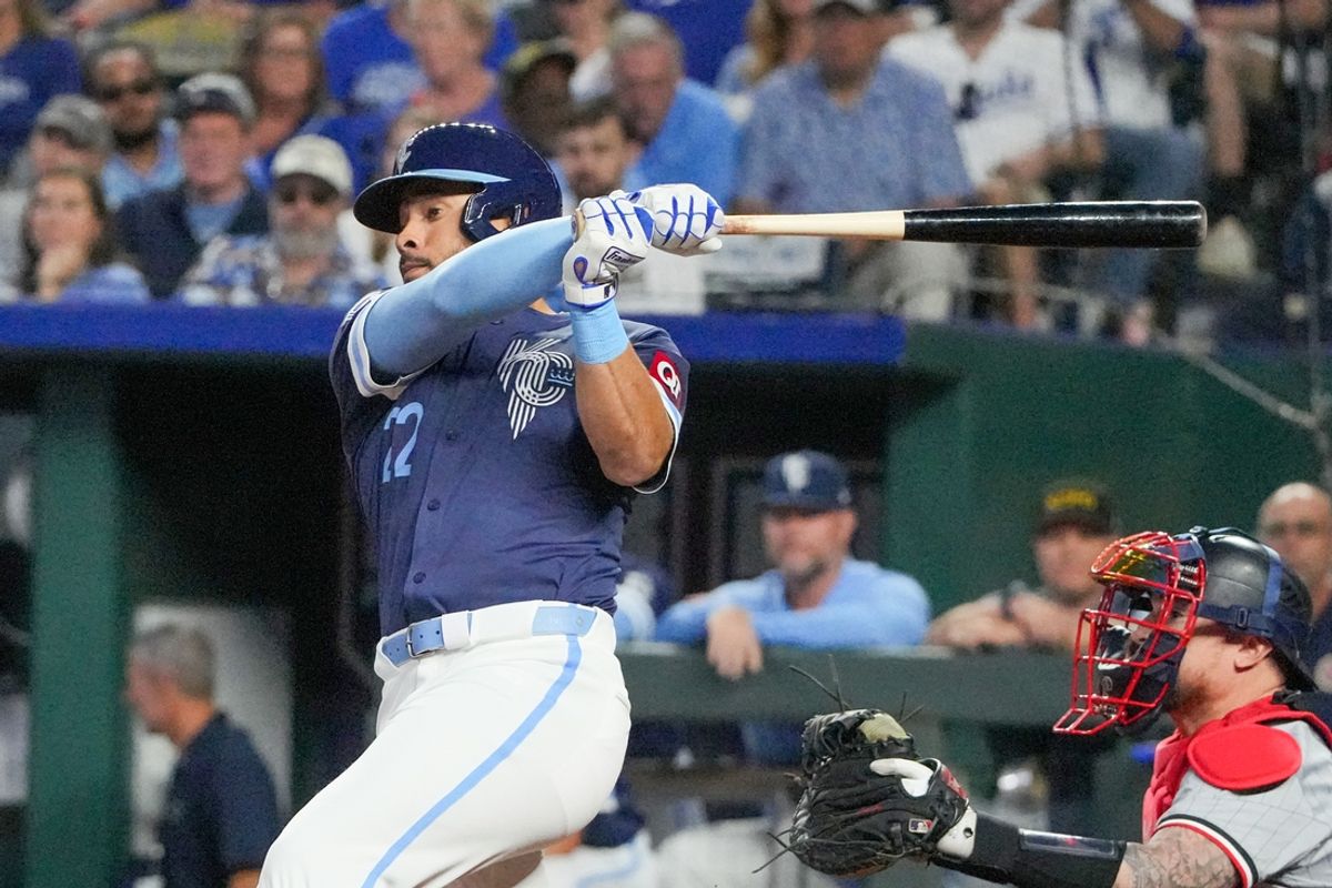 Sep 6, 2024; Kansas City, Missouri, USA; Kansas City Royals left fielder Tommy Pham (22) hits a one run double against the Minnesota Twins in the third inning at Kauffman Stadium. Mandatory Credit: Denny Medley-Imagn Images
