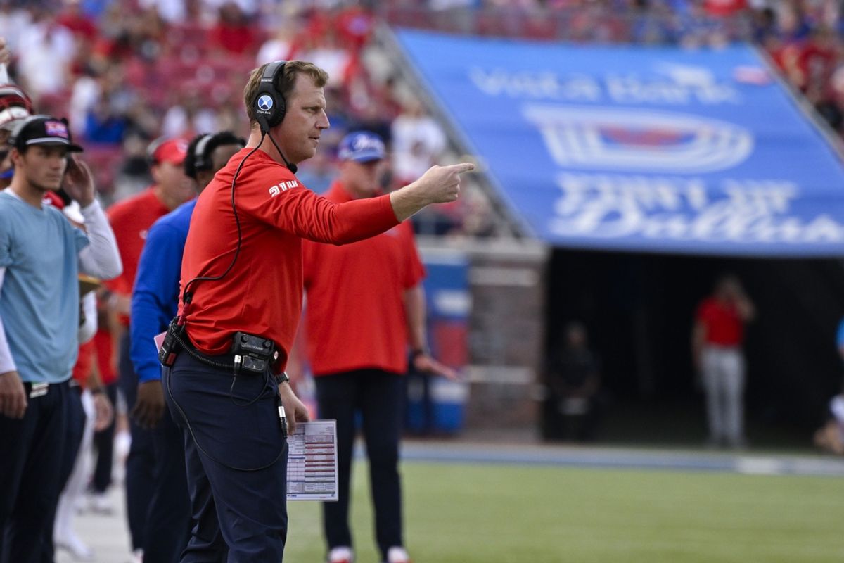 Sep 6, 2024; Dallas, Texas, USA; Southern Methodist Mustangs head coach Rhett Lashlee motions to his players during the first half against the Brigham Young Cougars at Gerald J. Ford Stadium. Mandatory Credit: Jerome Miron-Imagn Images