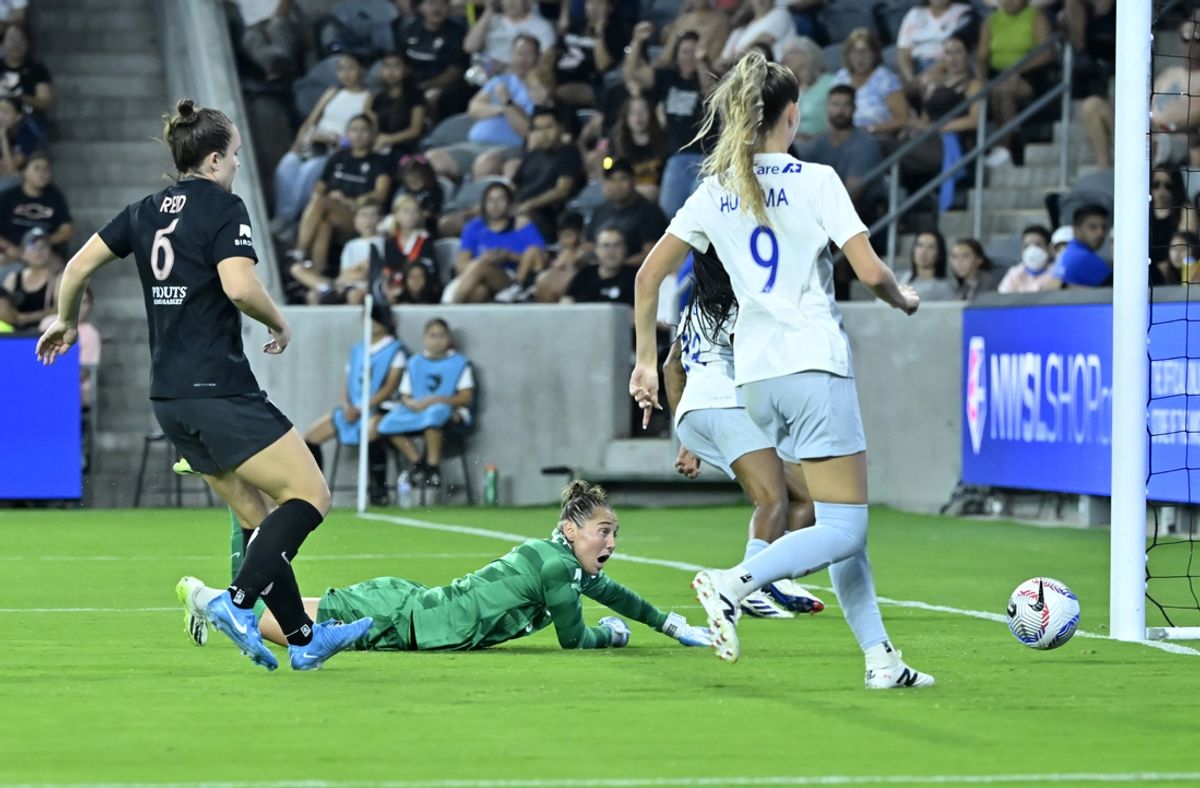 Sep 6, 2024; Los Angeles, California, USA; Angel City FC goalkeeper DiDi Haracic (13) dives for a goal by Seattle Reign FC forward Tziarra King (23) during the second half at BMO Stadium. Mandatory Credit: Robert Hanashiro-USA TODAY Sports
