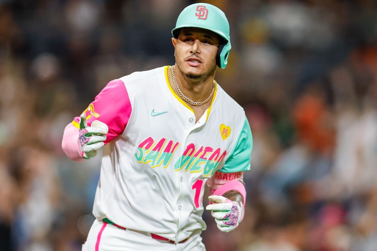 Sep 6, 2024; San Diego, California, USA; San Diego Padres third basemen Manny Machado (13) points to the dugout after hitting a one run home run during the eighth inning against the San Francisco Giants at Petco Park. Mandatory Credit: David Frerker-Imagn Images