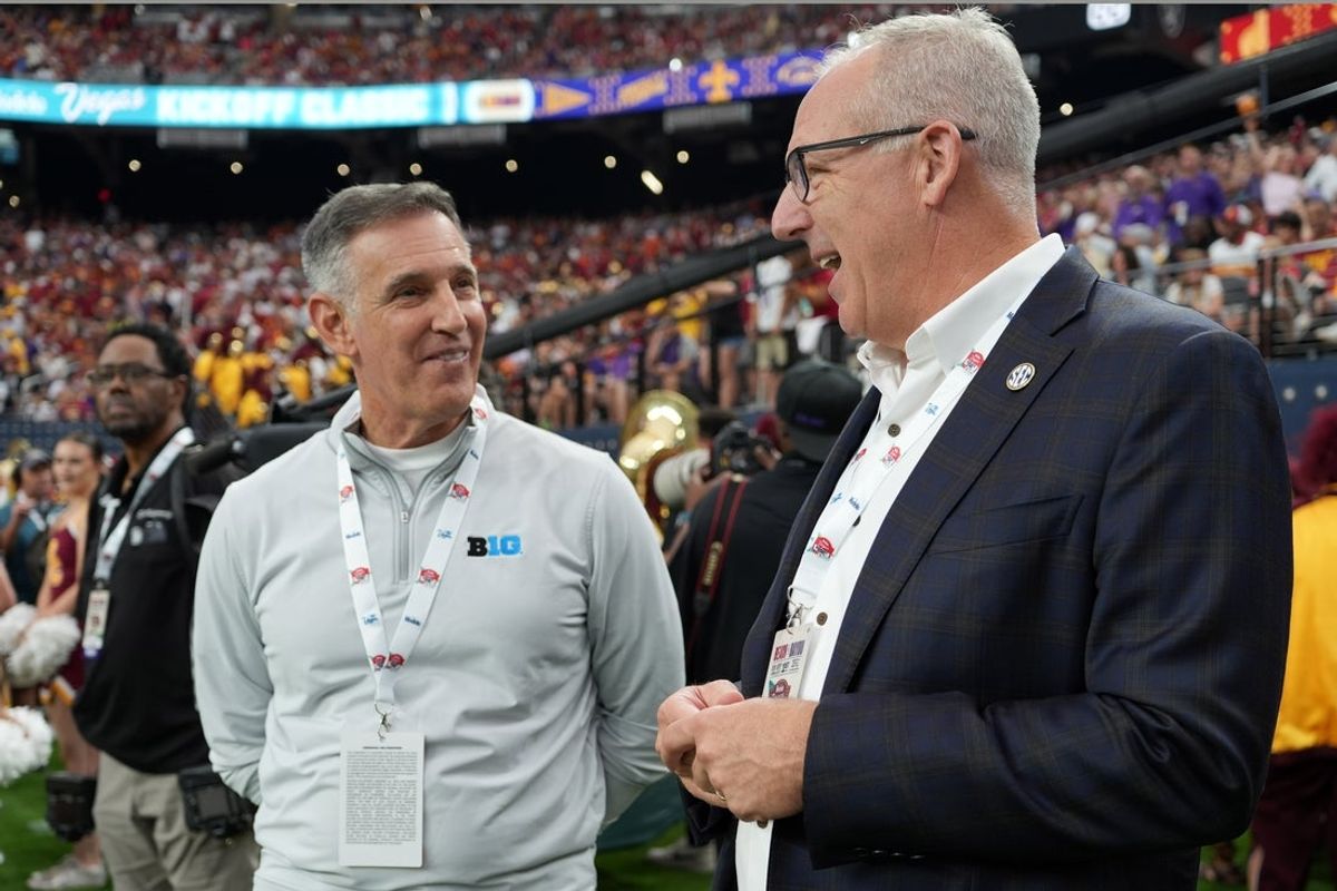 Sep 1, 2024; Paradise, Nevada, USA; Big 10 commissioner Tony Petitti (left) and SEC commissioner Greg Sankey attend the game between the LSU Tigers and the Southern California Trojans at Allegiant Stadium. Mandatory Credit: Kirby Lee-USA TODAY Sports
