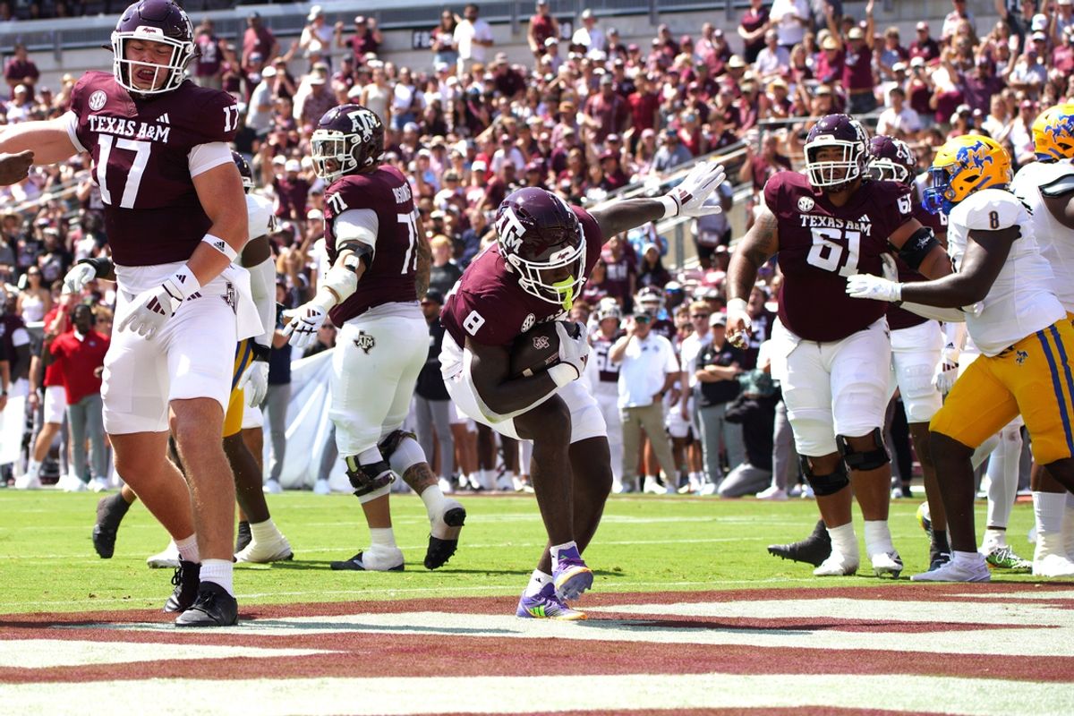 Sep 7, 2024; College Station, Texas, USA; Texas A&M Aggies running back Le'Veon Moss (8) scores a touchdown against the McNeese State Cowboys during the first quarter at Kyle Field. Mandatory Credit: Dustin Safranek-Imagn Images