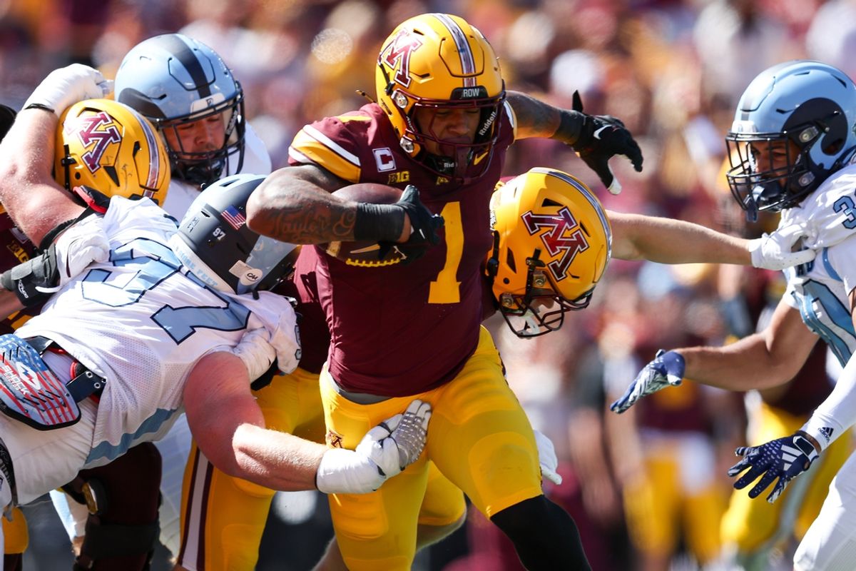 Sep 7, 2024; Minneapolis, Minnesota, USA; Minnesota Golden Gophers running back Darius Taylor (1) runs for a touchdown against the Rhode Island Rams during the first half at Huntington Bank Stadium. Mandatory Credit: Matt Krohn-Imagn Images