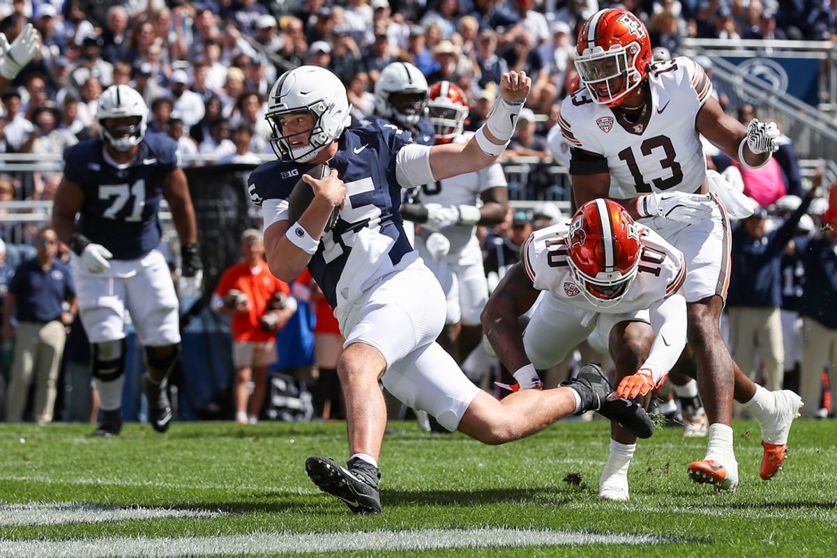 Sep 7, 2024; University Park, Pennsylvania, USA; Penn State Nittany Lions quarterback Drew Allar (15) rushes for a touchdown during the first quarter against the Bowling Green Falcons at Beaver Stadium. Mandatory Credit: Matthew O'Haren-Imagn Images