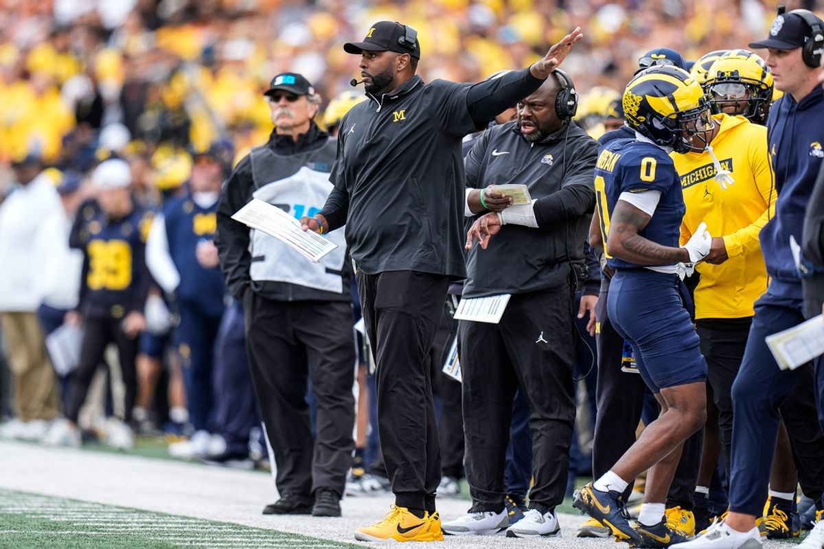 Michigan head coach Sherrone Moore calls a play against Texas during the first half at Michigan Stadium in Ann Arbor on Saturday, September 7, 2024.