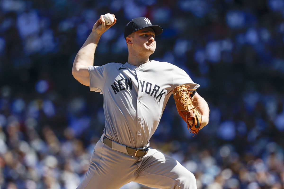 Sep 7, 2024; Chicago, Illinois, USA; New York Yankees starting pitcher Clarke Schmidt (36) delivers a pitch against the Chicago Cubs during the first inning at Wrigley Field. Mandatory Credit: Kamil Krzaczynski-Imagn Images