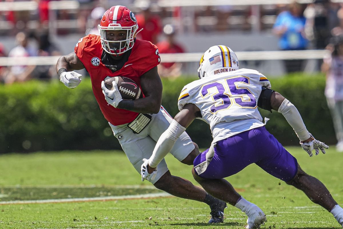 Sep 7, 2024; Athens, Georgia, USA; Georgia Bulldogs running back Nate Frazier (3) runs against Tennessee Tech Golden Eagles defensive back Eric Taylor (35) during the first half at Sanford Stadium. Mandatory Credit: Dale Zanine-Imagn Images