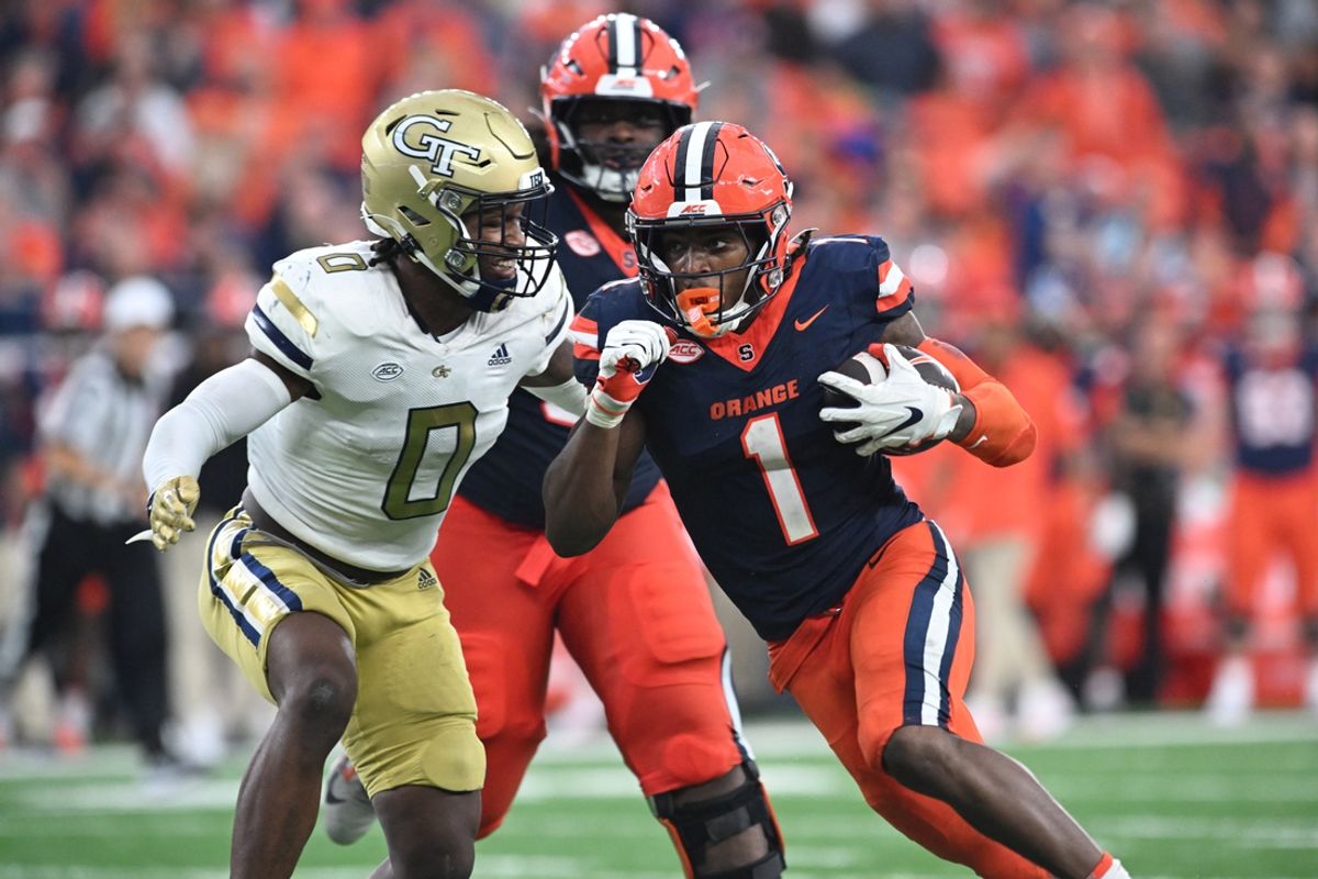 Sep 7, 2024; Syracuse, New York, USA; Syracuse Orange running back LeQuint Allen (1) prepares for contact by Georgia Tech Yellow Jackets linebacker Trenilyas Tatum (0) in the fourth quarter at the JMA Wireless Dome. Mandatory Credit: Mark Konezny-Imagn Images
