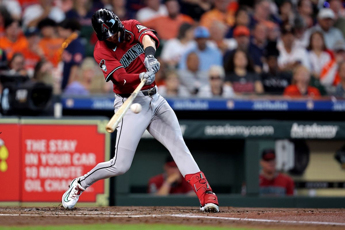 Sep 7, 2024; Houston, Texas, USA; Arizona Diamondbacks shortstop Kevin Newman (18) hits an RBI single against the Houston Astros during the second inning at Minute Maid Park. Mandatory Credit: Erik Williams-Imagn Images