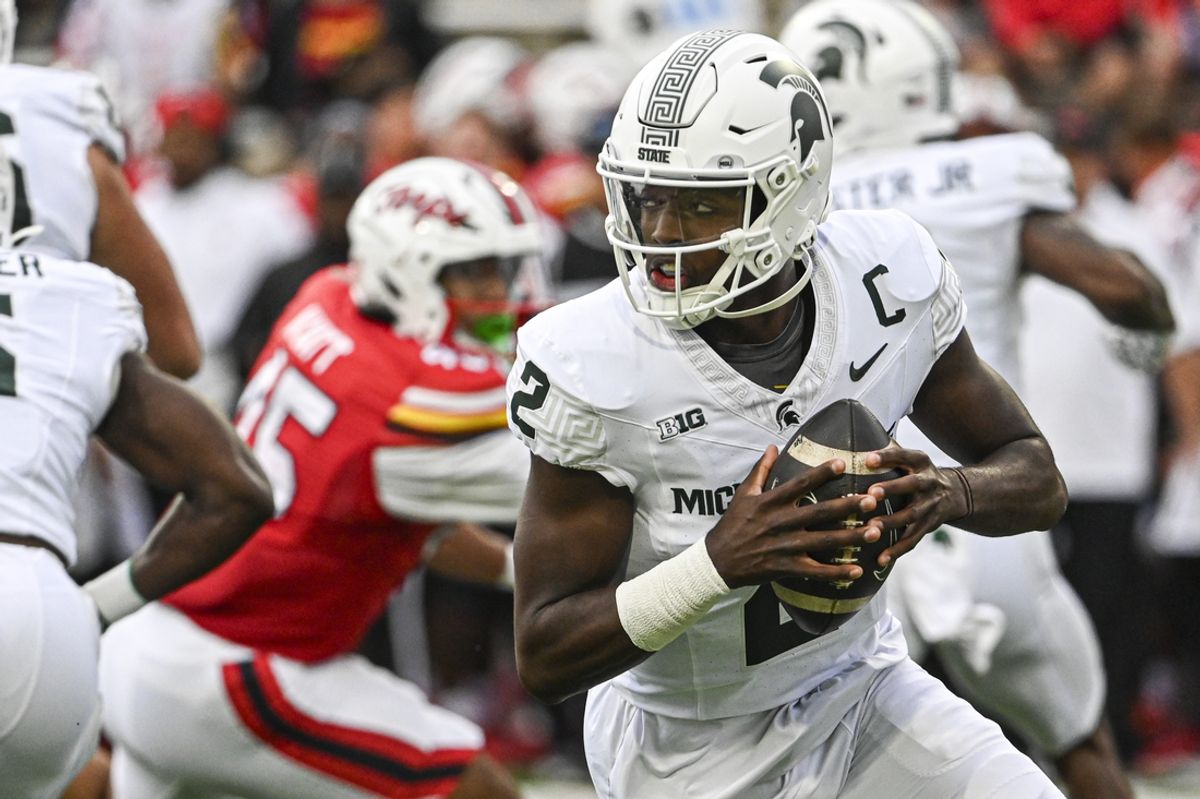 Sep 7, 2024; College Park, Maryland, USA;  Michigan State Spartans quarterback Aidan Chiles (2) rolls pit top pass during the first half against the Maryland Terrapins at SECU Stadium. Mandatory Credit: Tommy Gilligan-Imagn Images
