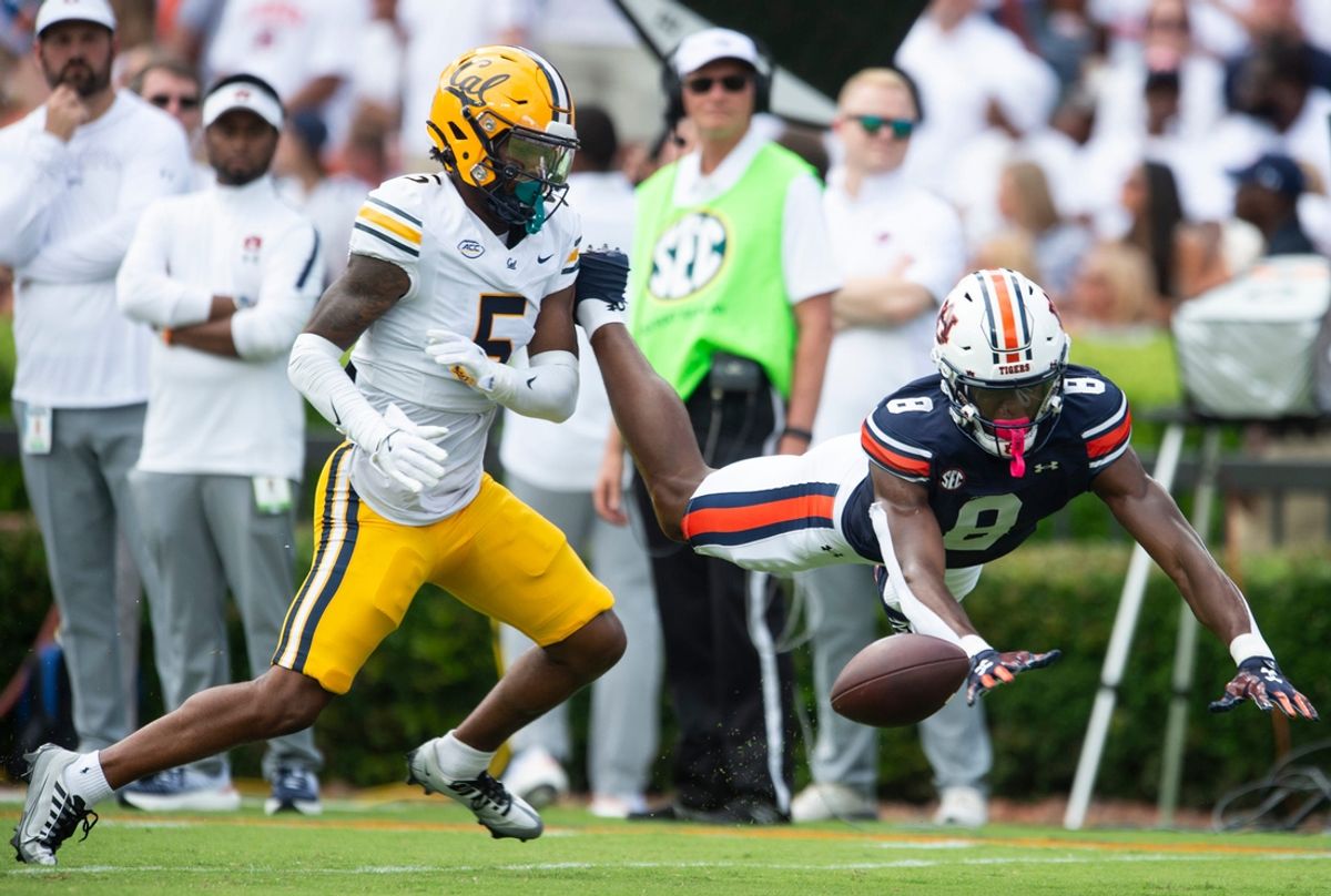 California Golden Bears defensive back Marcus Harris (5) breaks up a pass intended for Auburn Tigers wide receiver Cam Coleman (8) as Auburn Tigers take on California Golden Bears at Jordan-Hare Stadium in Auburn, Ala., on Saturday, Sept. 7, 2024. California Golden Bears leads Auburn Tigers 14-7 at halftime.