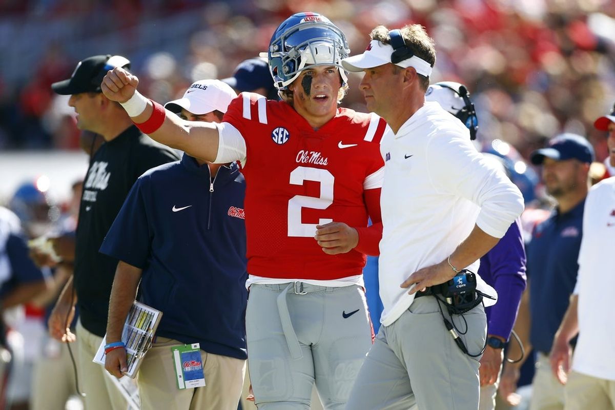 Sep 7, 2024; Oxford, Mississippi, USA; Mississippi Rebels quarterback Jaxson Dart (2) talks with head coach Lane Kiffin on the sideline during the first half against the Middle Tennessee Blue Raiders at Vaught-Hemingway Stadium. Mandatory Credit: Petre Thomas-Imagn Images