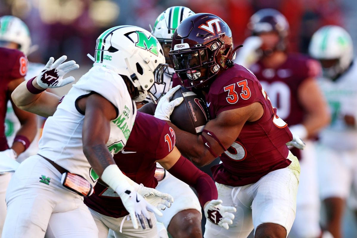 Sep 7, 2024; Blacksburg, Virginia, USA; Virginia Tech Hokies running back Bhayshul Tuten (33) runs the ball during the second quarter against the Marshall Thundering Herd at Lane Stadium. Mandatory Credit: Peter Casey-Imagn Images