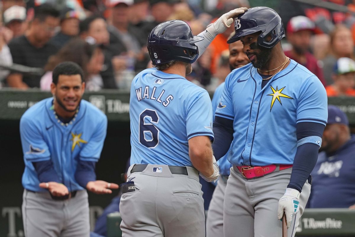 Sep 7, 2024; Baltimore, Maryland, USA; Tampa Bay Rays shortstop Taylor Walls (6) greeted by designated hitter Yandy Diaz (2) following his third inning solo home run against the Baltimore Orioles at Oriole Park at Camden Yards. Mandatory Credit: Mitch Stringer-Imagn Images