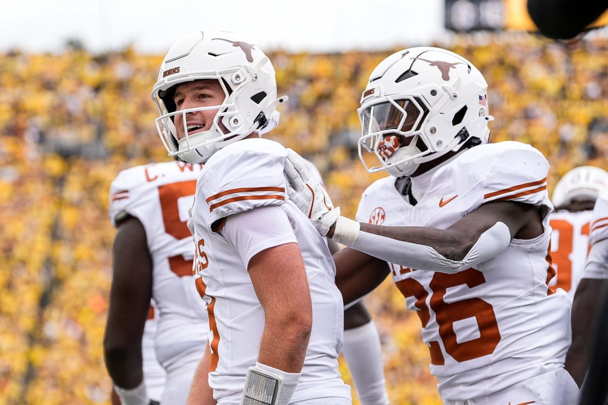 Texas quarterback Quinn Ewers (3) celebrates a touchdown against Michigan during the first half at Michigan Stadium in Ann Arbor on Saturday, September 7, 2024.