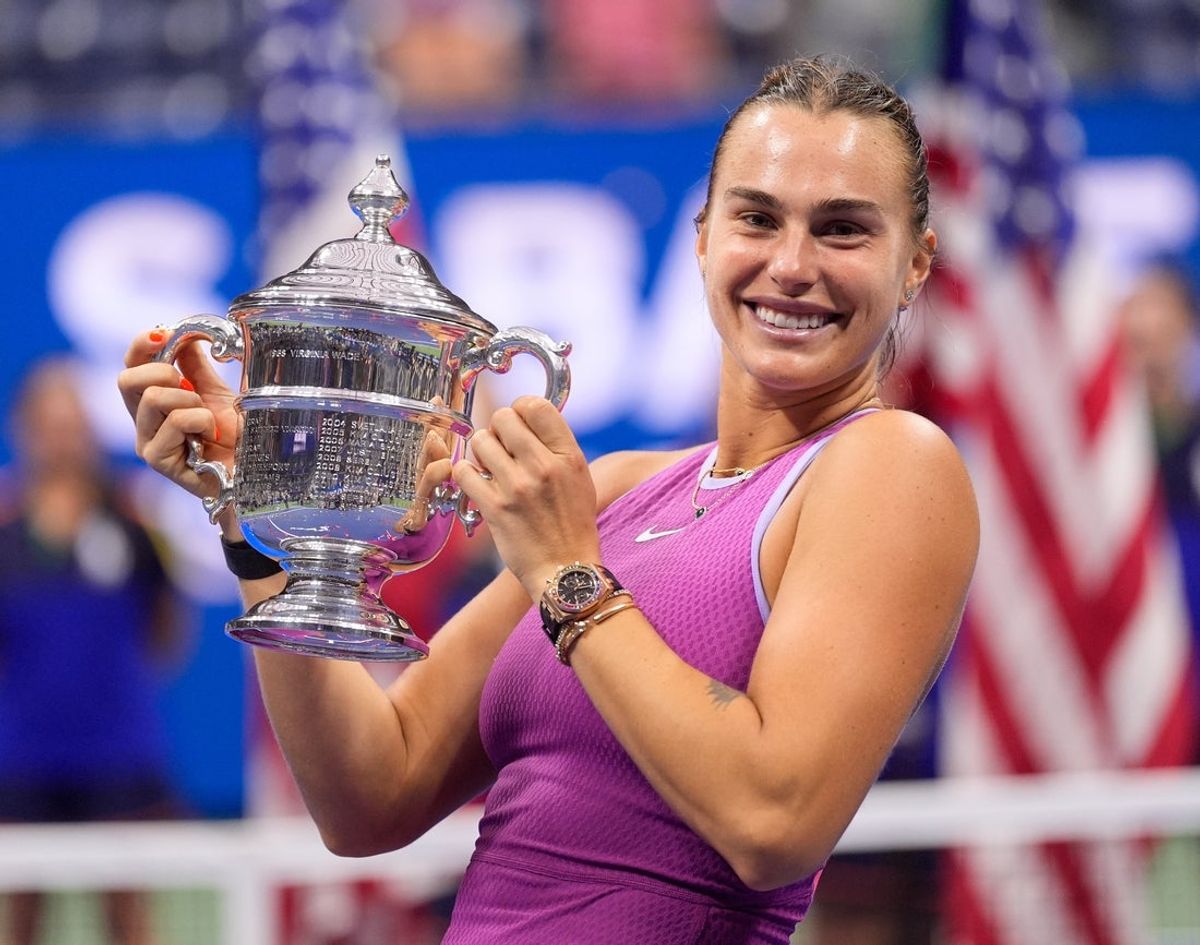 Sept 7, 2024; Flushing, NY, USA  Aryna Sabalenka with the US Open Trophy after beating Jessica Pegula (USA) in the women's singles final on day thirteen of the 2024 U.S. Open tennis tournament at USTA Billie Jean King National Tennis Center. Mandatory Credit: Robert Deutsch-Imagn Images