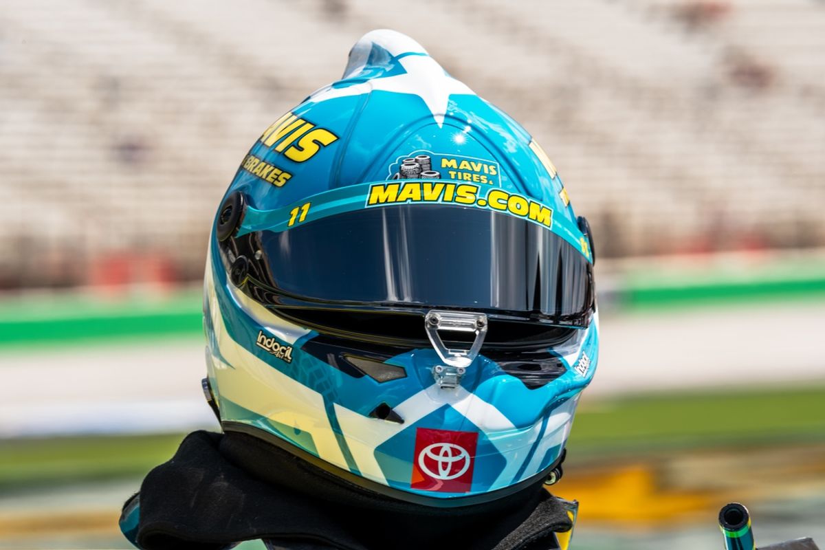 Sep 7, 2024; Hampton, Georgia, USA; The helmet of NASCAR Cup Series driver Denny Hamlin (11) rests on the top of his car before qualifying at Atlanta Motor Speedway. Mandatory Credit: Jason Allen-Imagn Images