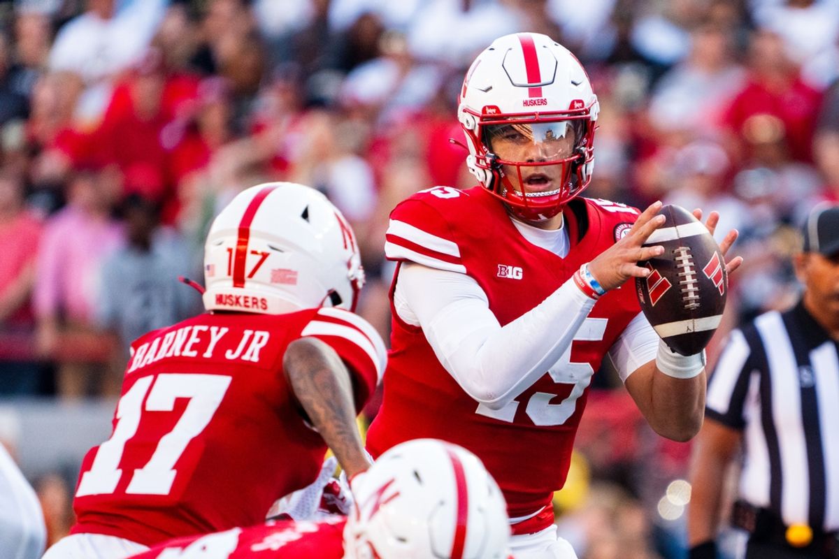 Sep 7, 2024; Lincoln, Nebraska, USA; Nebraska Cornhuskers quarterback Dylan Raiola (15) hands the ball off to wide receiver Jacory Barney Jr. (17) against the Colorado Buffaloes during the first quarter at Memorial Stadium. Mandatory Credit: Dylan Widger-Imagn Images