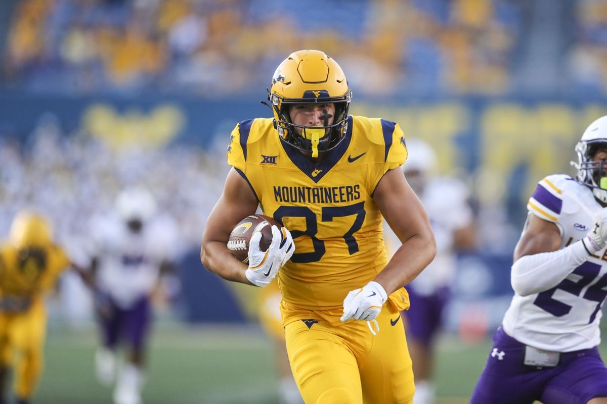 Sep 7, 2024; Morgantown, West Virginia, USA; West Virginia Mountaineers tight end Kole Taylor (87) catches a pass and runs for a touchdown during the second quarter against the Albany Great Danes at Mountaineer Field at Milan Puskar Stadium. Mandatory Credit: Ben Queen-Imagn Images