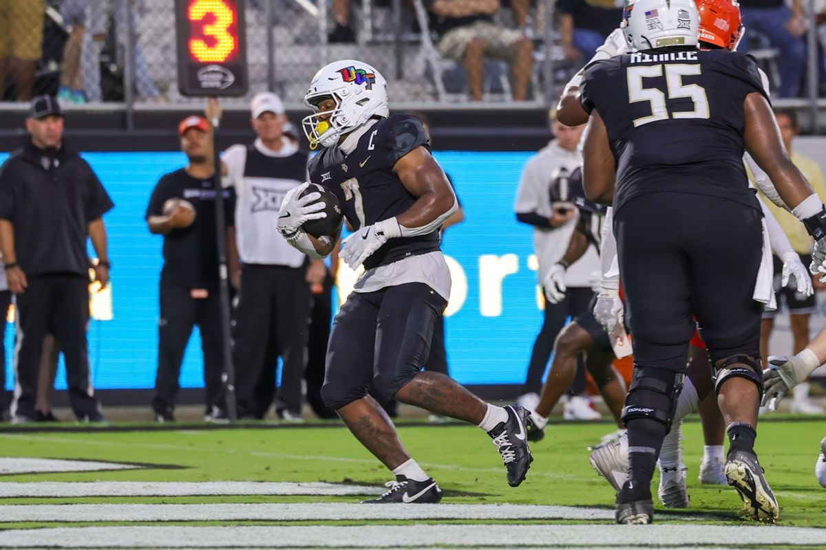 Sep 7, 2024; Orlando, Florida, USA; UCF Knights running back RJ Harvey (7) scores a touchdown during the first quarter against the Sam Houston State Bearkats at FBC Mortgage Stadium. Mandatory Credit: Mike Watters-Imagn Images