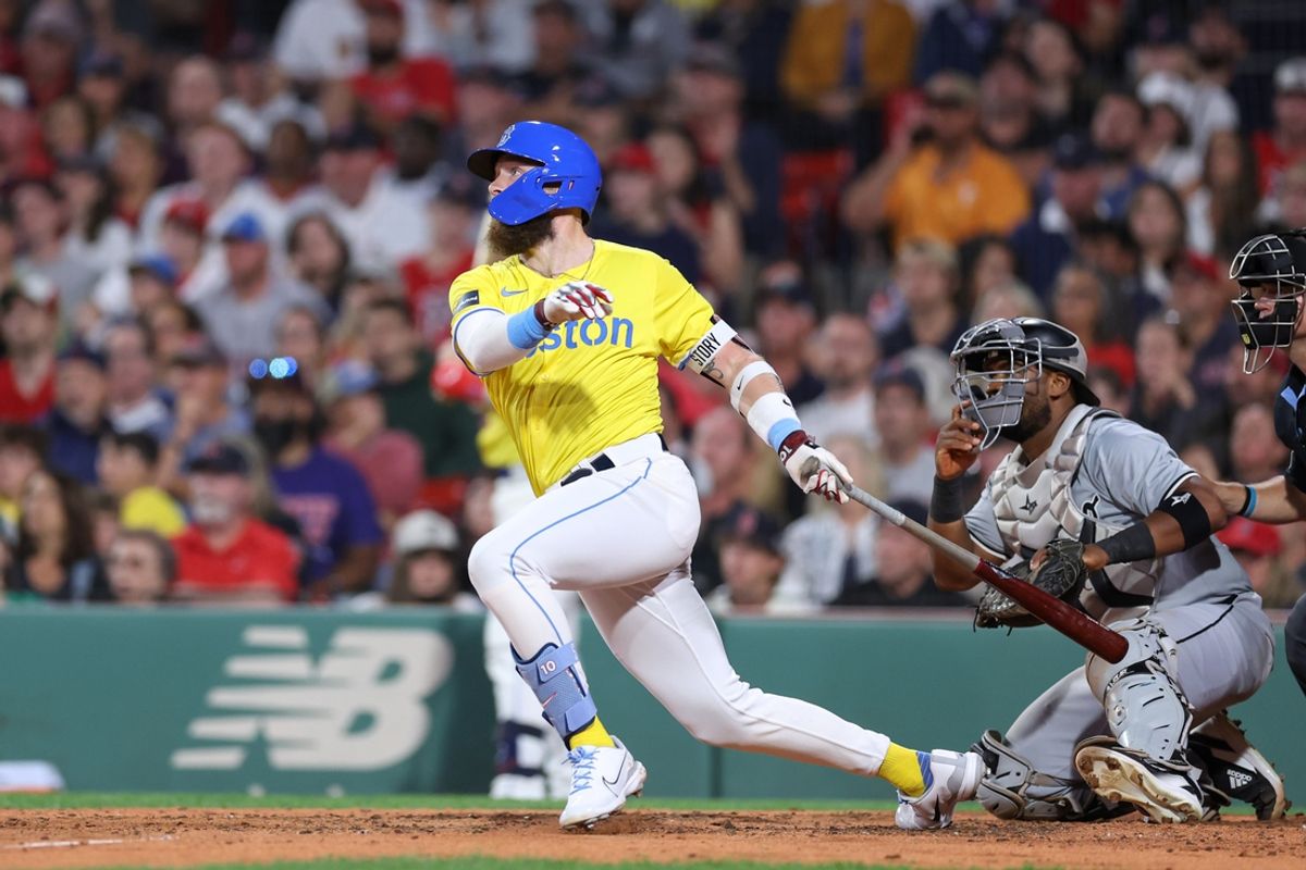 Sep 7, 2024; Boston, Massachusetts, USA; Boston Red Sox shortstop Trevor Story (10) hits an RBI single during the third inning against the Chicago White Sox at Fenway Park. Mandatory Credit: Paul Rutherford-Imagn Images