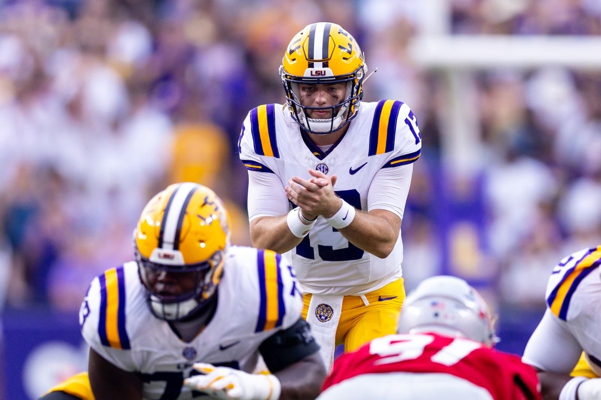 Sep 7, 2024; Baton Rouge, Louisiana, USA; LSU Tigers quarterback Garrett Nussmeier (13) calls for the ball against the Nicholls State Colonels during the first half at Tiger Stadium. Mandatory Credit: Stephen Lew-Imagn Images