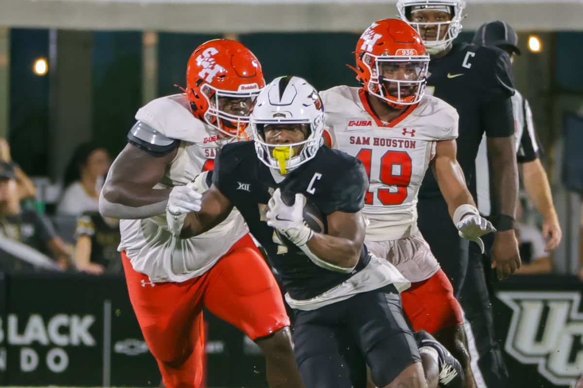 Sep 7, 2024; Orlando, Florida, USA; UCF Knights running back RJ Harvey (7) runs the ball during the second quarter against the Sam Houston State Bearkats at FBC Mortgage Stadium. Mandatory Credit: Mike Watters-Imagn Images