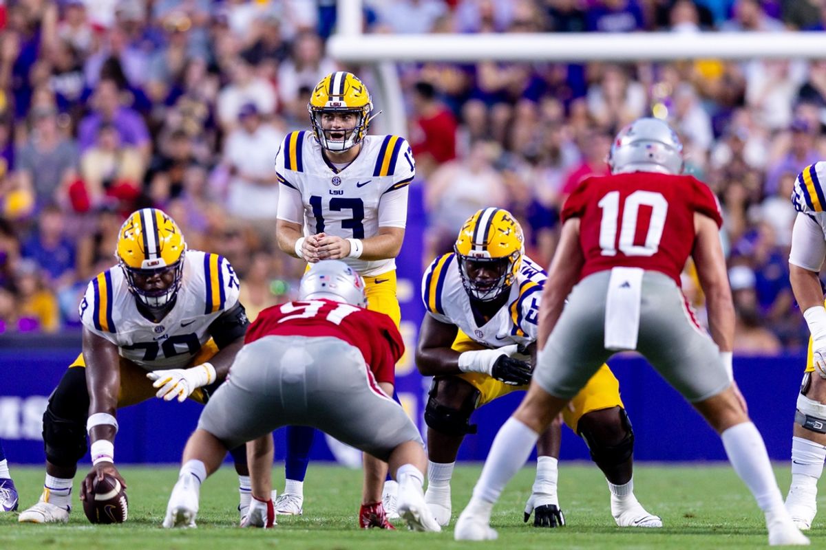 Sep 7, 2024; Baton Rouge, Louisiana, USA; LSU Tigers quarterback Garrett Nussmeier (13) looks over the Nicholls State Colonels defense during the first half at Tiger Stadium. Mandatory Credit: Stephen Lew-Imagn Images