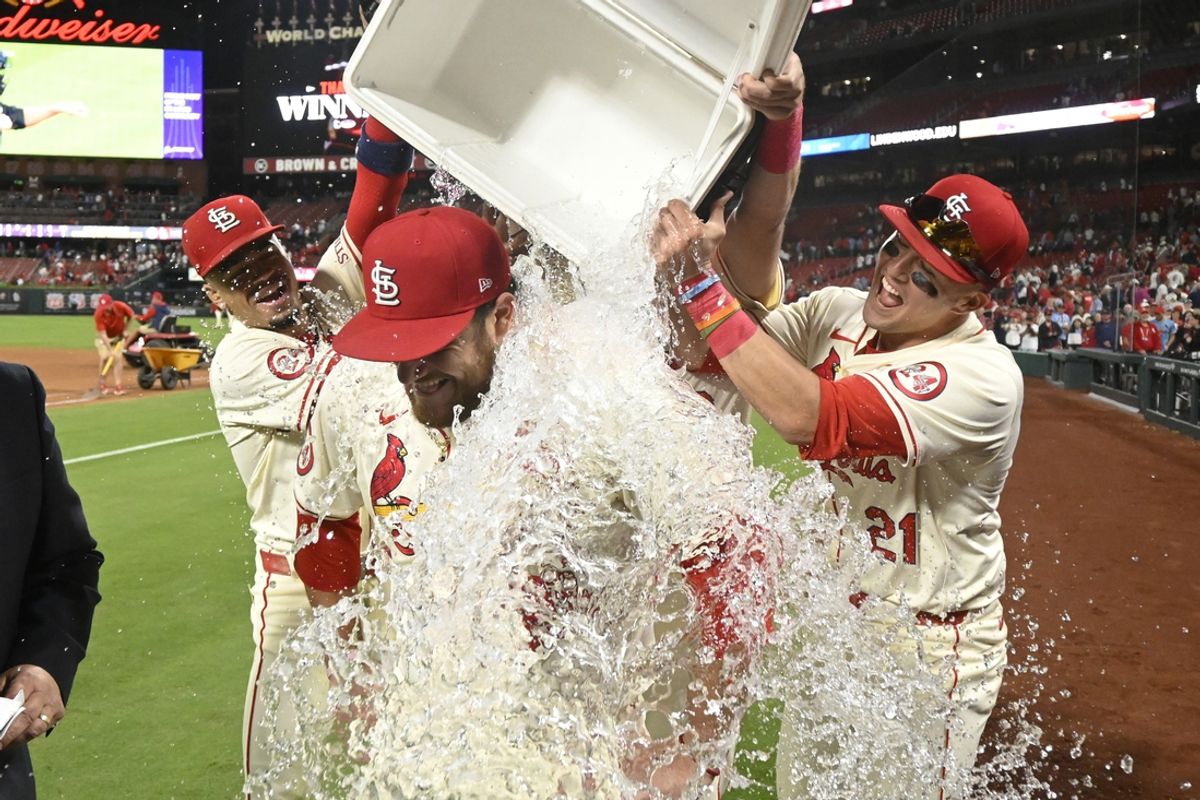Sep 7, 2024; St. Louis, Missouri, USA; St. Louis Cardinals catcher Pedro Pages (43) is doused with water by St. Louis Cardinals shortstop Masyn Winn (0) and St. Louis Cardinals left fielder Lars Nootbaar (21) after beating the Seattle Mariners at Busch Stadium. Mandatory Credit: Joe Puetz-Imagn Images
