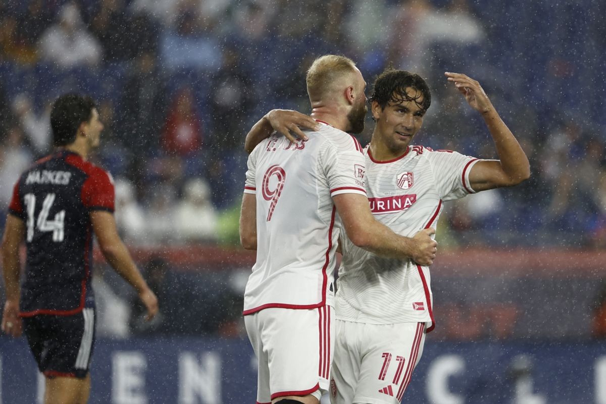 Sep 7, 2024; Foxborough, Massachusetts, USA; St. Louis CITY SC forward Simon Becher (11) celebrates a goal with forward Klauss (9) in the second half against the New England Revolution at Gillette Stadium. Mandatory Credit: Winslow Townson-Imagn Images