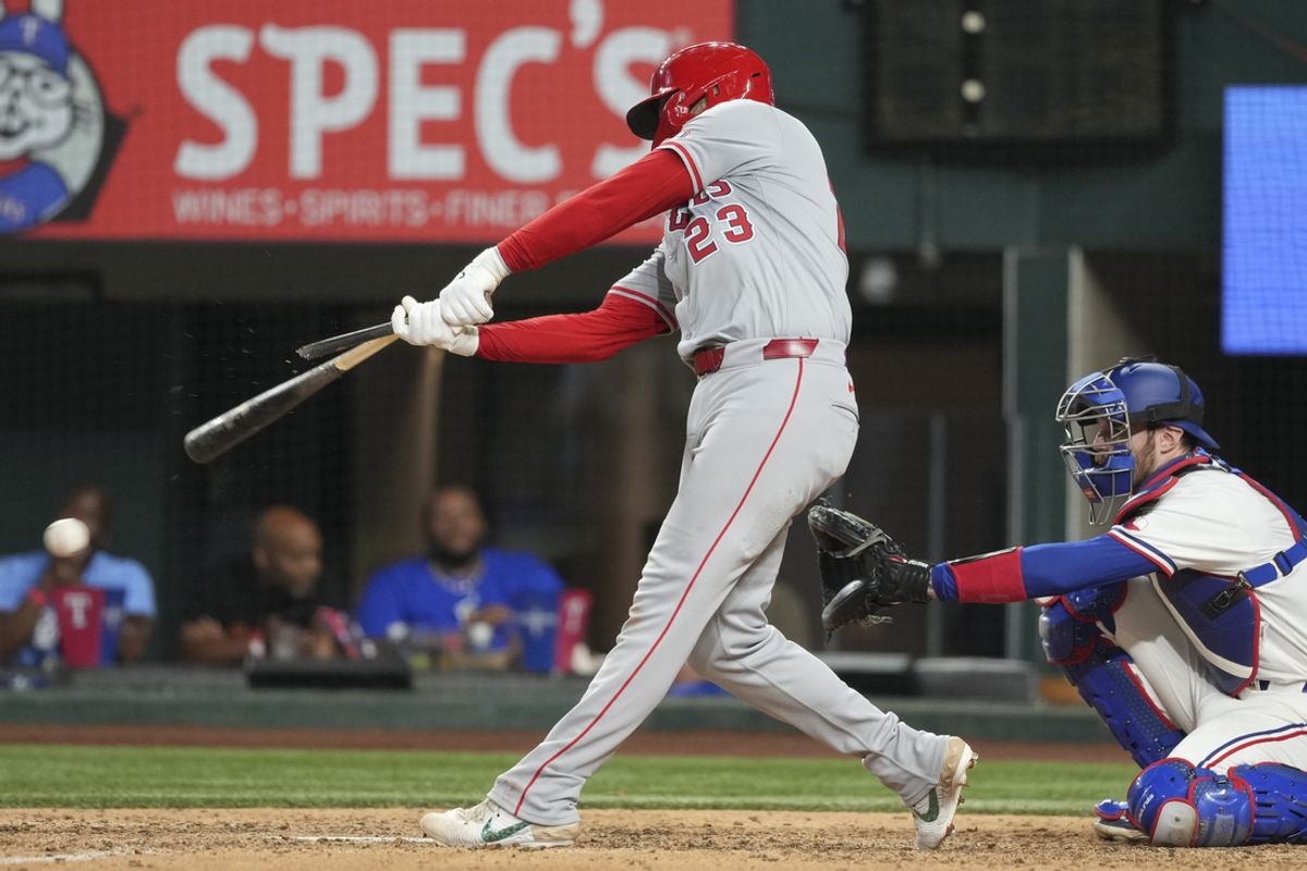 Sep 7, 2024; Arlington, Texas, USA; Los Angeles Angels second baseman Brandon Drury (23) grounds out with a broken bat against the Texas Rangers during the ninth inning at Globe Life Field. Mandatory Credit: Jim Cowsert-Imagn Images