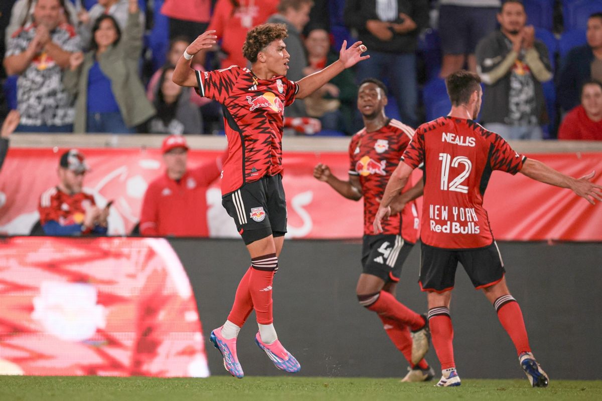 Sep 7, 2024; Harrison, New Jersey, USA; New York Red Bulls forward Julian Hall (16) celebrates with teammates  after scoring a goal during the second half against Sporting Kansas City at Red Bull Arena. Mandatory Credit: Vincent Carchietta-Imagn Images